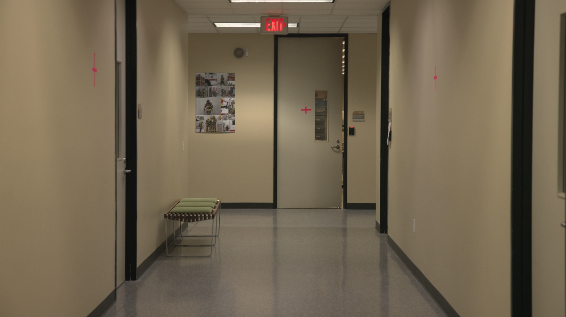 Empty hallway with tracking markers on walls